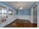 Bright dining room with hardwood floors, built-in cabinetry, and French doors at 103 Lakeside Dr., Tabor City, NC 28463