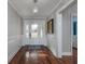 Bright and airy entryway with hardwood floors and elegant chandelier at 103 Lakeside Dr., Tabor City, NC 28463