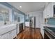 Updated kitchen featuring white shaker cabinets, stainless steel appliances, and quartz countertops at 103 Lakeside Dr., Tabor City, NC 28463