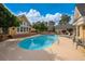 Inviting oval pool with spa, surrounded by a large deck and landscaping at 103 Lakeside Dr., Tabor City, NC 28463