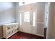 Bright entryway with hardwood floors and decorative storage cabinet at 1047 Rose Haven Dr., Conway, SC 29527