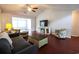 Living room features hardwood floors, fireplace and large TV at 1047 Rose Haven Dr., Conway, SC 29527