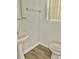 Clean bathroom with pedestal sink, toilet and shower at 105 S Merriman Rd., Georgetown, SC 29440