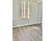 Bright bedroom featuring wood-look flooring and window at 105 S Merriman Rd., Georgetown, SC 29440