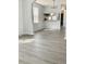 Dining area with gray vinyl plank flooring and view of the kitchen at 105 S Merriman Rd., Georgetown, SC 29440