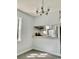 Dining room with gray vinyl plank flooring and a view of the kitchen at 105 S Merriman Rd., Georgetown, SC 29440