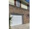 Brick home with attached garage and white garage door at 105 S Merriman Rd., Georgetown, SC 29440