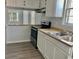 Kitchen with white cabinets, stainless steel appliances, and light countertops at 105 S Merriman Rd., Georgetown, SC 29440