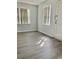 Bright living room with gray vinyl plank flooring and neutral walls at 105 S Merriman Rd., Georgetown, SC 29440