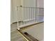 White railing stairs with gray flooring and carpet at 105 S Merriman Rd., Georgetown, SC 29440