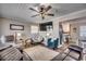 Cozy living room featuring a sectional sofa, armchairs, and a large TV at 1100 Naomi Ave., Conway, SC 29526