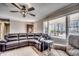 Living room with sectional sofa, armchair, and large windows at 1100 Naomi Ave., Conway, SC 29526