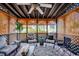 Relaxing screened porch with seating and ceiling fan at 1100 Naomi Ave., Conway, SC 29526