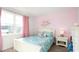 Charming bedroom with pink walls, white bed frame, and whimsical bedding at 120 Shucking St., Myrtle Beach, SC 29588