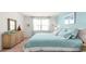 Main bedroom with a king-size bed and light teal bedding at 120 Shucking St., Myrtle Beach, SC 29588