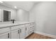 Bathroom featuring a white vanity with black hardware, quartz countertop, and a large mirror at 1201 Possum Trot Rd., North Myrtle Beach, SC 29582