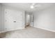 Bedroom features neutral carpet, white trim and doors, and a ceiling fan at 1201 Possum Trot Rd., North Myrtle Beach, SC 29582