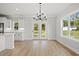 Bright dining room with access to the kitchen and backyard at 1201 Possum Trot Rd., North Myrtle Beach, SC 29582