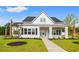 Beautiful new construction home with manicured lawn and light brick walkway at 1201 Possum Trot Rd., North Myrtle Beach, SC 29582