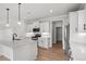 Modern kitchen with white cabinets, quartz counters, and stainless appliances at 1201 Possum Trot Rd., North Myrtle Beach, SC 29582