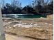 Landscaped backyard with a pond and fountain feature at 1201 Possum Trot Rd., North Myrtle Beach, SC 29582