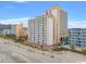 Aerial view of beachfront condo building, showcasing its location and surrounding area at 1205 S Ocean Blvd. # 50412, Myrtle Beach, SC 29577