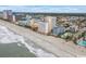 Aerial view of beachfront property, showing ocean, beach, and high-rise buildings at 1205 S Ocean Blvd. # 50412, Myrtle Beach, SC 29577