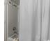 Shower stall with curtain in condo bathroom at 1205 S Ocean Blvd. # 50412, Myrtle Beach, SC 29577