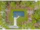 Bird's-eye view of a house with a driveway and surrounding trees at 121 Crossroad Dr. Nw, Calabash, SC 28467