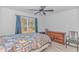 Bedroom with wood dresser, two chairs, and a window overlooking trees at 121 Crossroad Dr. Nw, Calabash, SC 28467