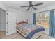 Bright bedroom with a double bed, window, and ceiling fan at 121 Crossroad Dr. Nw, Calabash, SC 28467