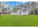 House exterior showcasing a two-car garage and green lawn at 121 Crossroad Dr. Nw, Calabash, SC 28467