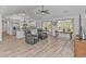 Open living area with hardwood floors and kitchen view at 121 Crossroad Dr. Nw, Calabash, SC 28467