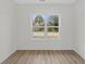 Bright bedroom with wood-look floors and large window at 127 Stonewall Circle # 6-4, Longs, SC 29568