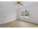 Bright bedroom with wood-look floors and large window at 127 Stonewall Circle # 6-4, Longs, SC 29568