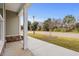 Bright front porch overlooking a tree-lined street at 127 Stonewall Circle # 6-4, Longs, SC 29568