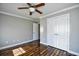 Simple bedroom with wood floors and double doors at 1288 Brighton Ave., Myrtle Beach, SC 29588