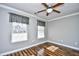 Well-lit bedroom with two windows and ceiling fan at 1288 Brighton Ave., Myrtle Beach, SC 29588