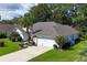 Single-story house with two-car garage and basketball hoop at 1392 Southwood Dr., Surfside Beach, SC 29575