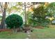 Landscaped backyard with fire pit and playset at 1392 Southwood Dr., Surfside Beach, SC 29575