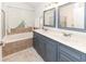 Bathroom with double vanity and soaking tub at 1392 Southwood Dr., Surfside Beach, SC 29575