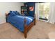 Serene bedroom with blue bedding and a window with blinds at 1392 Southwood Dr., Surfside Beach, SC 29575