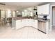 Spacious kitchen featuring granite countertops, stainless steel appliances, and white cabinets at 1392 Southwood Dr., Surfside Beach, SC 29575