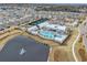 Aerial view of a community center, pool, tennis courts and common areas at 1410 Saw Palmetto St., North Myrtle Beach, SC 29582
