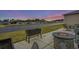 Outdoor patio area with furniture, fire pit, and scenic views of the surrounding water and neighborhood at 1410 Saw Palmetto St., North Myrtle Beach, SC 29582