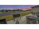 Outdoor patio with fire pit, seating, and water views at 1410 Saw Palmetto St., North Myrtle Beach, SC 29582