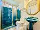 Bathroom with teal pedestal sink and shower at 1524 S Ocean Blvd. S # Penthouse, North Myrtle Beach, SC 29582