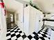 White kitchen cabinets and black and white floor at 1524 S Ocean Blvd. S # Penthouse, North Myrtle Beach, SC 29582