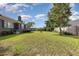 Large backyard with grassy area and mature trees at 1530 Deer Park Ln., Surfside Beach, SC 29575