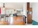 Dining area with wood floors and barn door leading to kitchen at 1530 Deer Park Ln., Surfside Beach, SC 29575